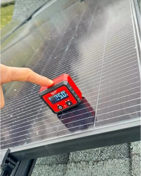 Checking a solar panel with a digital level