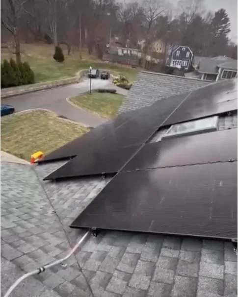 Solar panels around a skylight in Milton